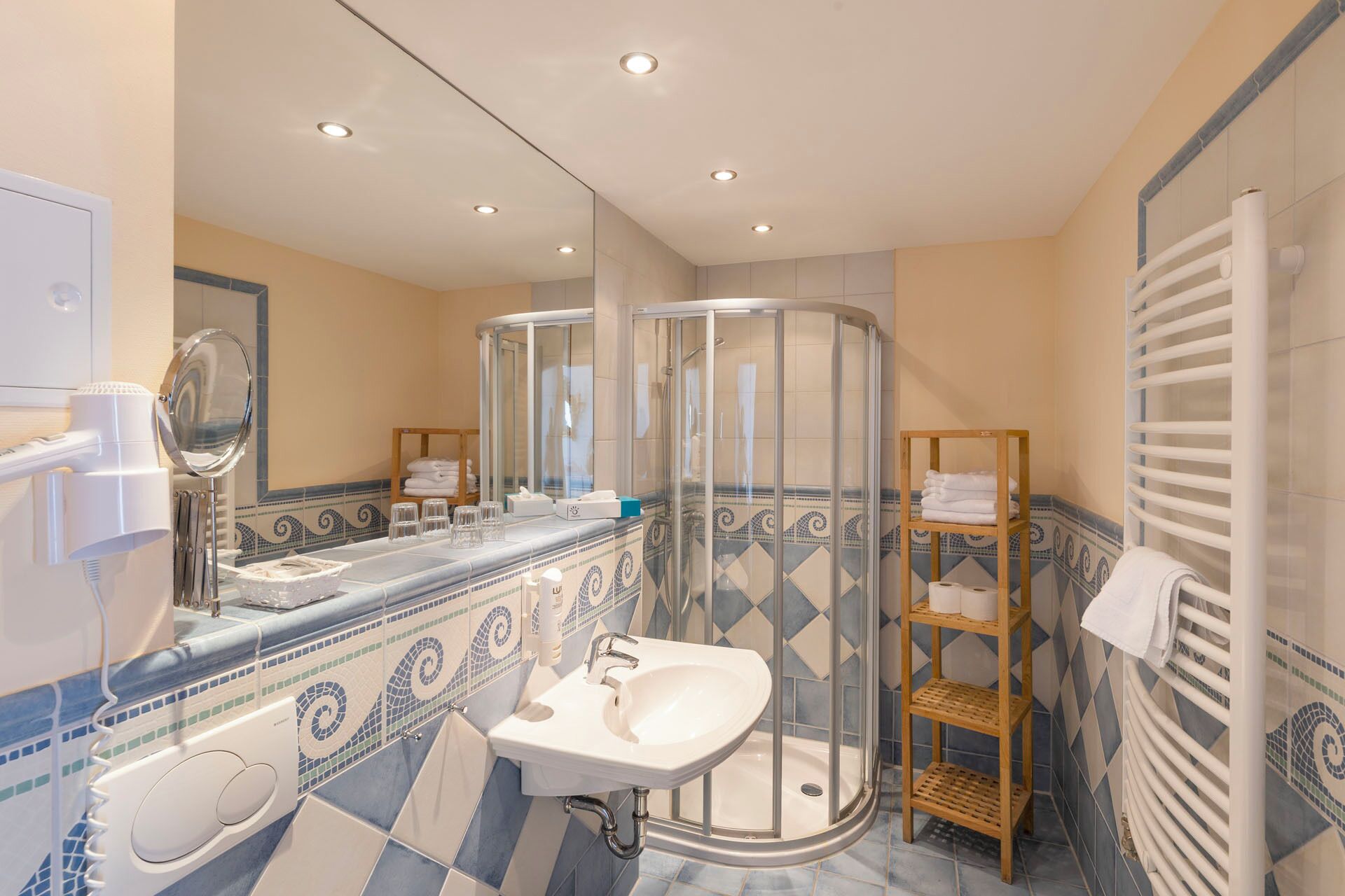 comfort suite | bathroom | shower, free toiletries, hair dryer, towels