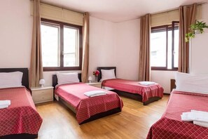 Triple Room, City View | Premium bedding, desk, iron/ironing board, free WiFi