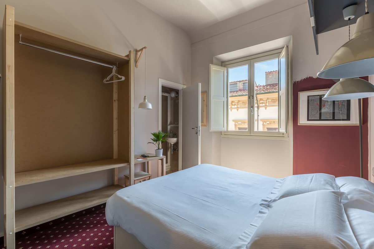 Premium bedding, down duvets, in-room safe, desk