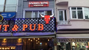 A building with a sign for "Istanbul Hotel Guesthouse" and a "T & P" sign below it. - Istanbul Hotel & Guesthouse  (Istanbul)