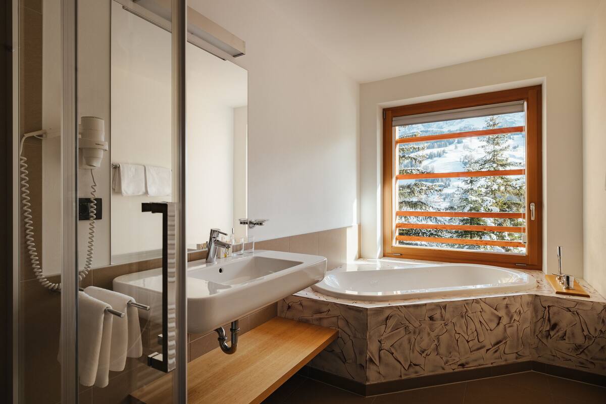 junior suite | bathroom | hair dryer, bathrobes, bidet, towels