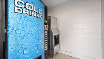 A vending machine labeled 'COLD DRINKS' with a water dispenser and a small grill unit.