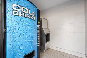 A vending machine labeled 'COLD DRINKS' with a water dispenser and a small grill unit. - Park Inn by Radisson, Weldon - Roanoke Rapids (Weldon)