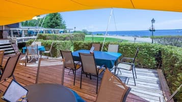 Enjoy a romantic meal on the shaded deck overlooking the ocean.