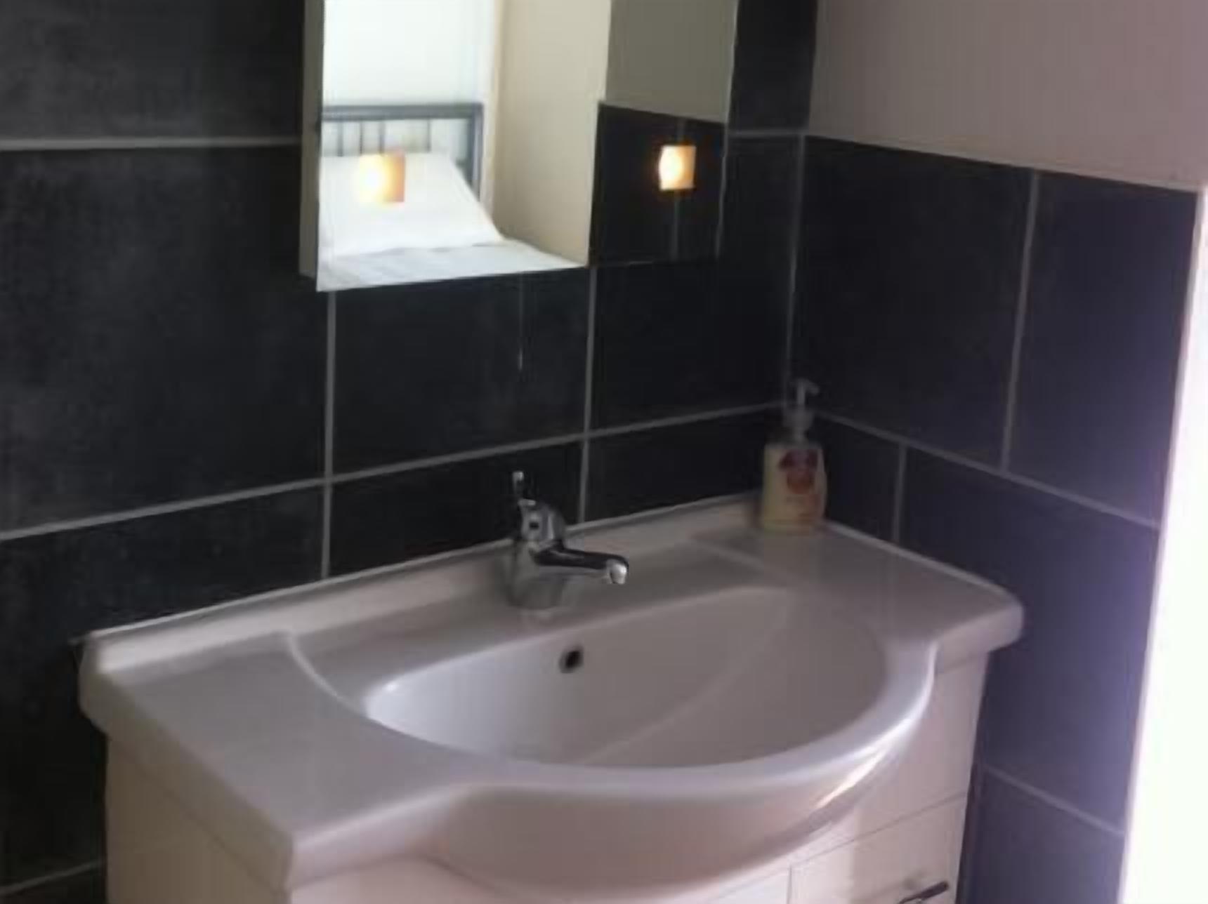 quadruple room with private bathroom | bathroom sink