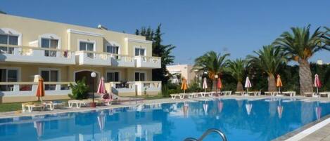 Seasonal outdoor pool, pool umbrellas, pool loungers