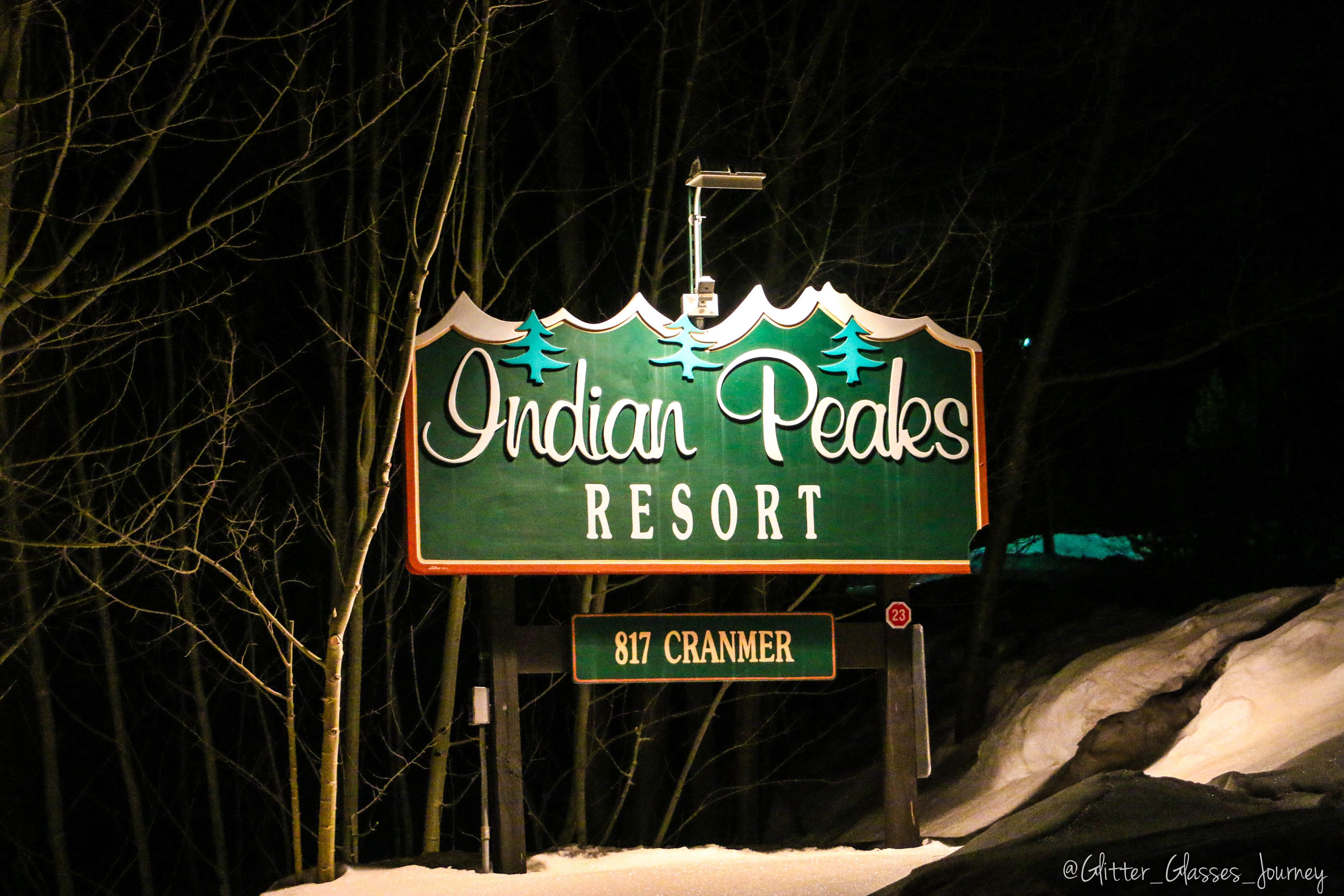 A sign for Indian Peaks Resort with the address 817 Cranmer.