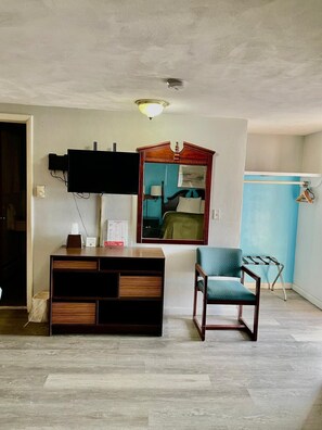 Room, 2 Bedrooms | Living area | 32-inch flat-screen TV with cable channels, TV