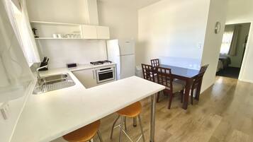 Apartment, 2 Bedrooms | Private kitchen | Full-sized fridge, microwave, stovetop, coffee/tea maker