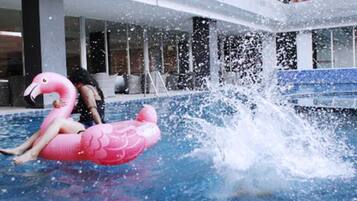 Outdoor pool, open 6:00 AM to 6:00 PM, pool loungers