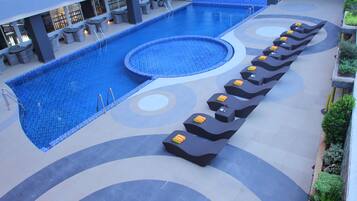 Outdoor pool, open 6:00 AM to 6:00 PM, pool loungers