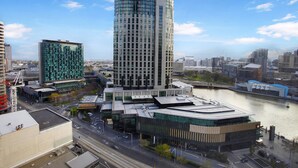 A modern building with a curved facade, situated near a river. - Corporate Keys - Freshwater Place (Southbank)