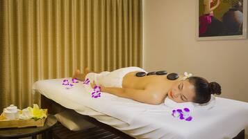 Experience rejuvenation in this serene spa treatment room, featuring a massage table and amenities for ultimate relaxation.