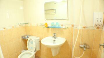 Shower, hair dryer, slippers, towels