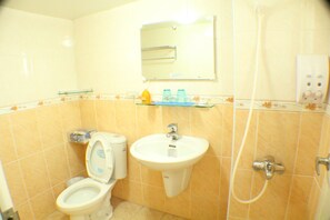 Shower, hair dryer, slippers, towels