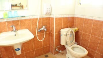 Shower, hair dryer, slippers, towels