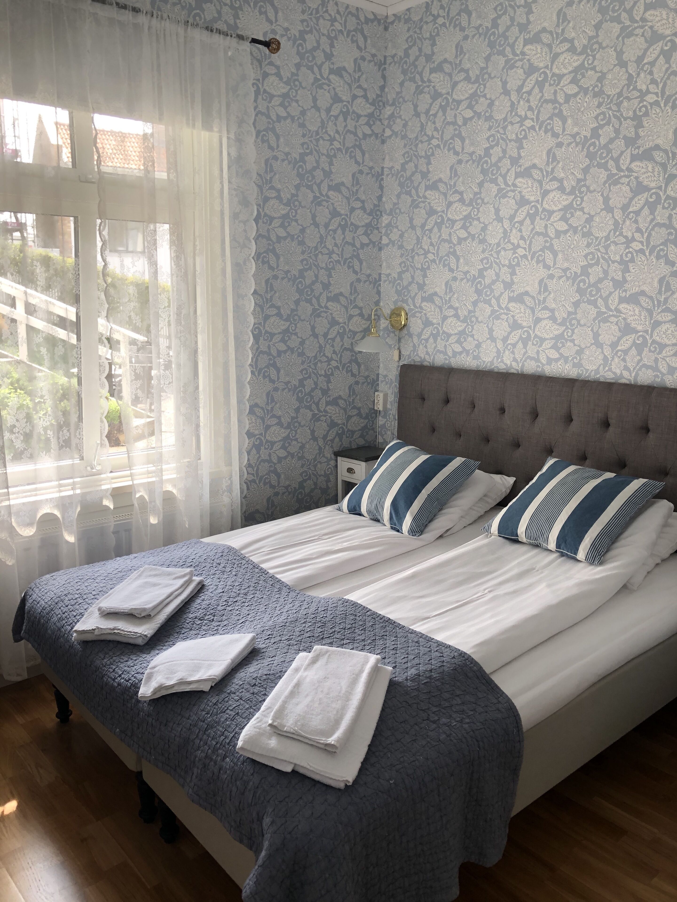 family room | premium bedding, desk, blackout curtains, iron/ironing board