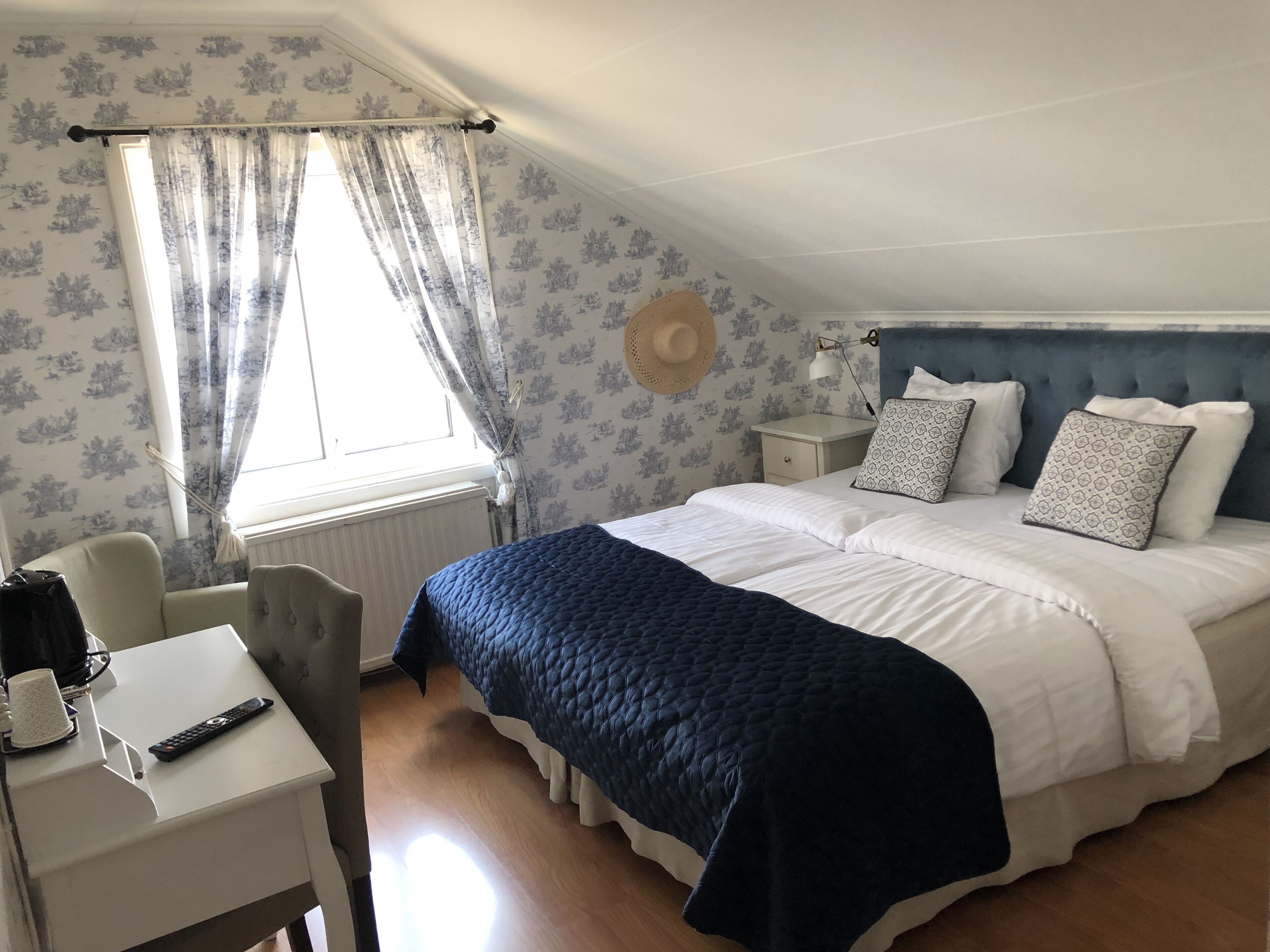 premium bedding, desk, blackout curtains, iron/ironing board