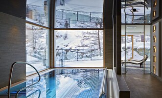 Indoor pool, open 8:00 AM to 8:00 PM, pool umbrellas, pool loungers
