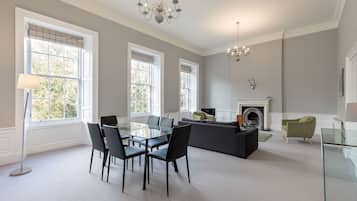 Classic Apartment, 2 Bedrooms | Living area | 50-inch flat-screen TV with cable channels, TV