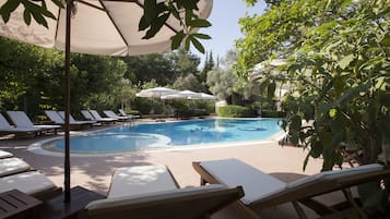 Outdoor pool, open 8:00 AM to 8:00 PM, pool umbrellas, sun loungers