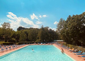 Seasonal outdoor pool, open 10:00 AM to 8:00 PM, pool umbrellas