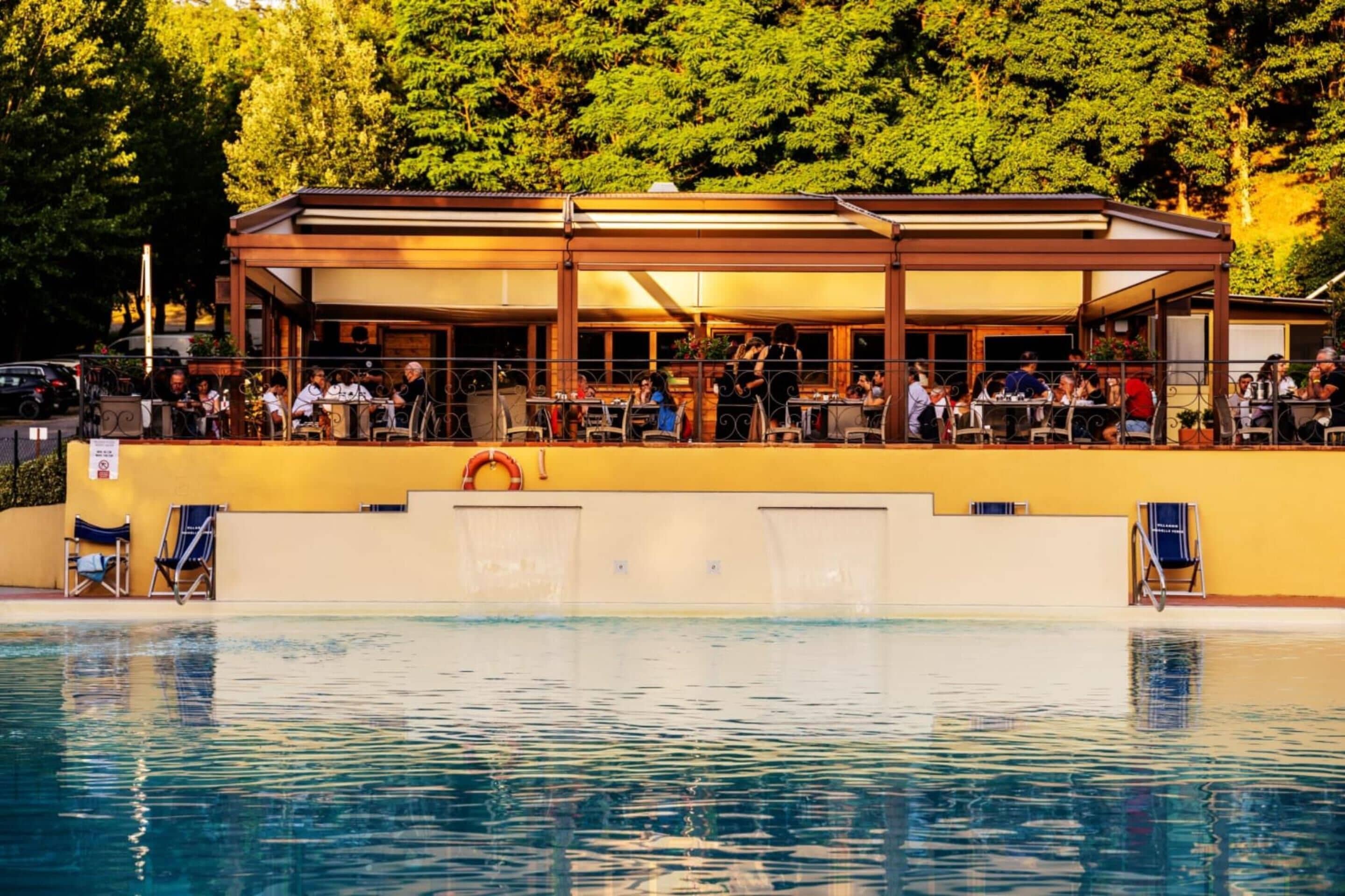 Seasonal outdoor pool, open 10:00 AM to 8:00 PM, pool umbrellas