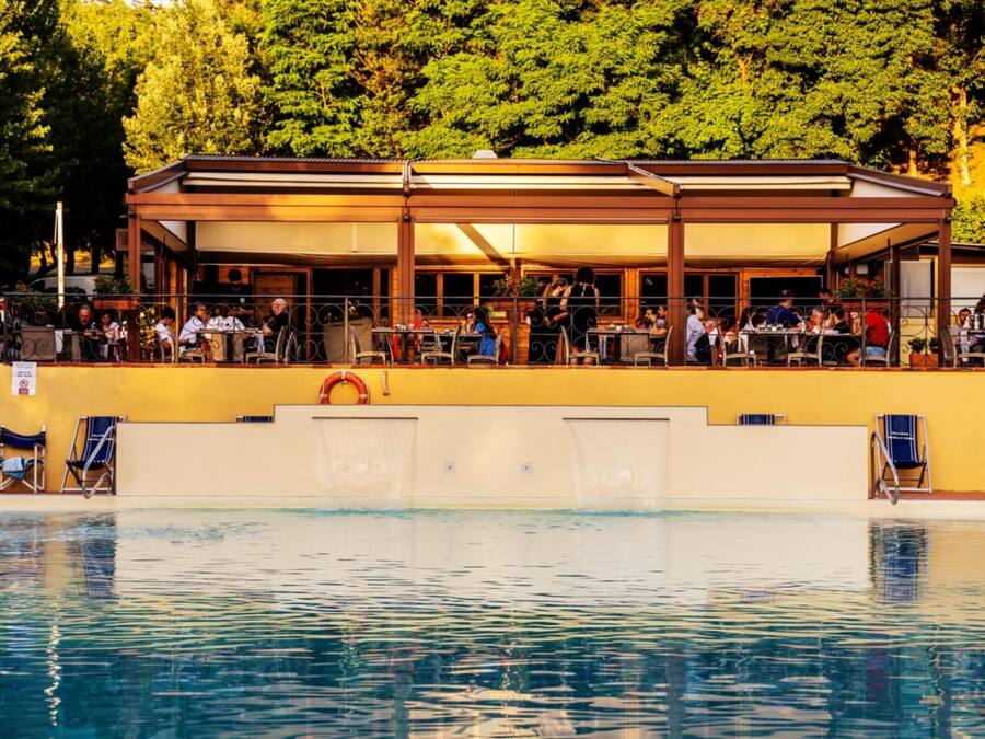 Seasonal outdoor pool, open 10:00 AM to 8:00 PM, pool umbrellas