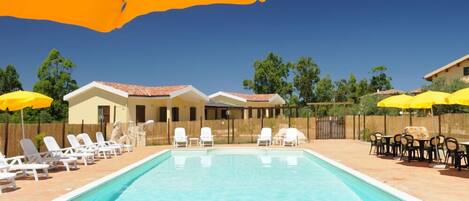 Seasonal outdoor pool, pool umbrellas, pool loungers