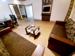 Family Suite | Living area | TV, fireplace - Richmond Hotel (Sylhet)