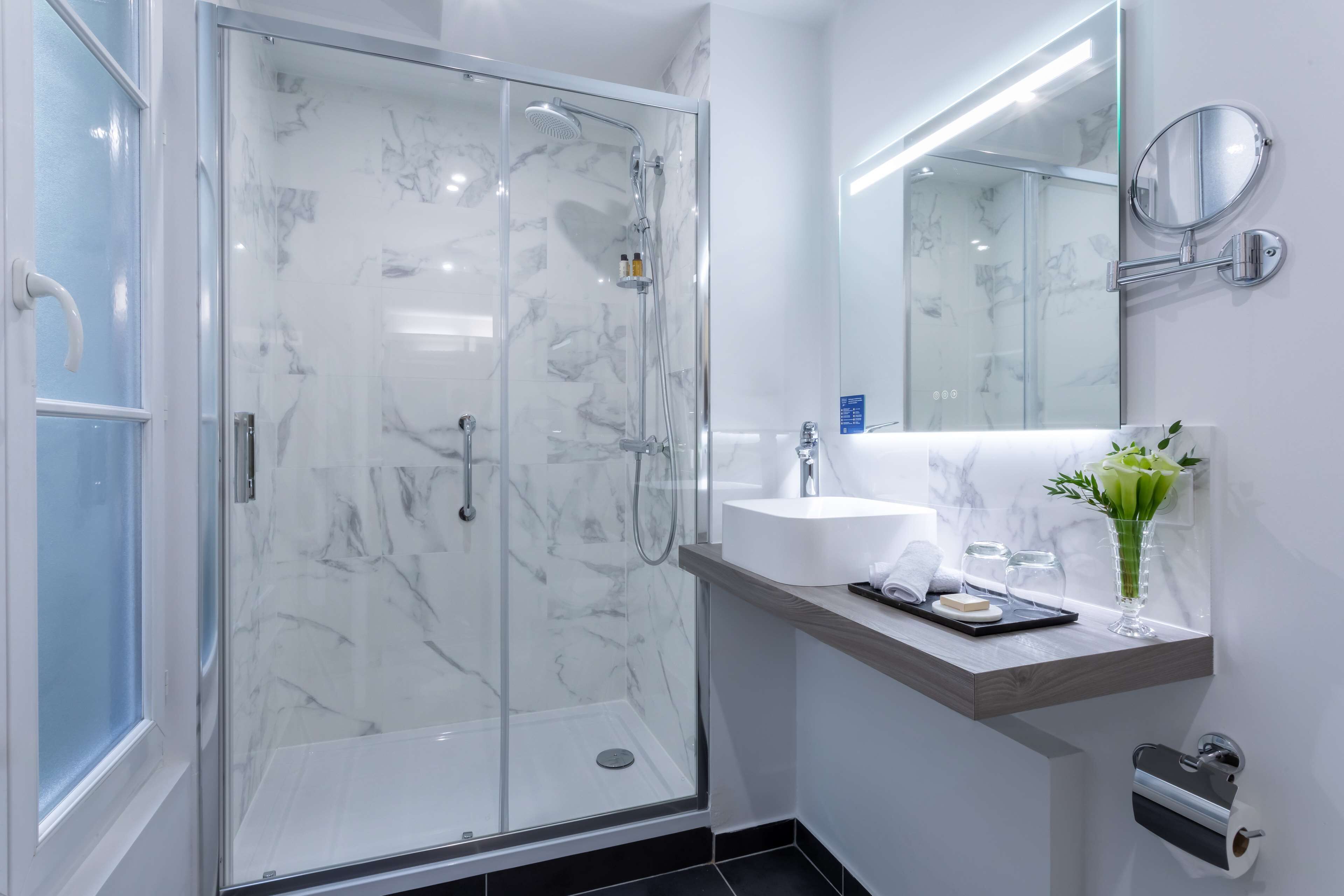 signature suite, 1 king bed | bathroom shower