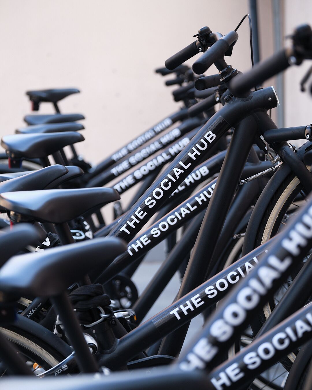 A row of bicycles with "The Social Hub" branding.