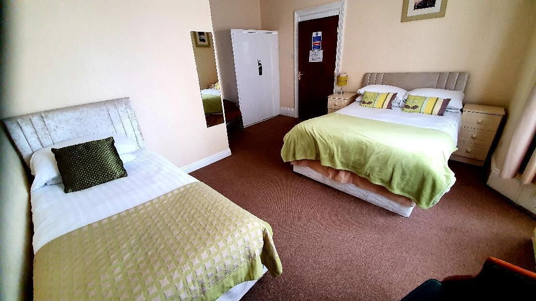 family room | desk, iron/ironing board, bed sheets