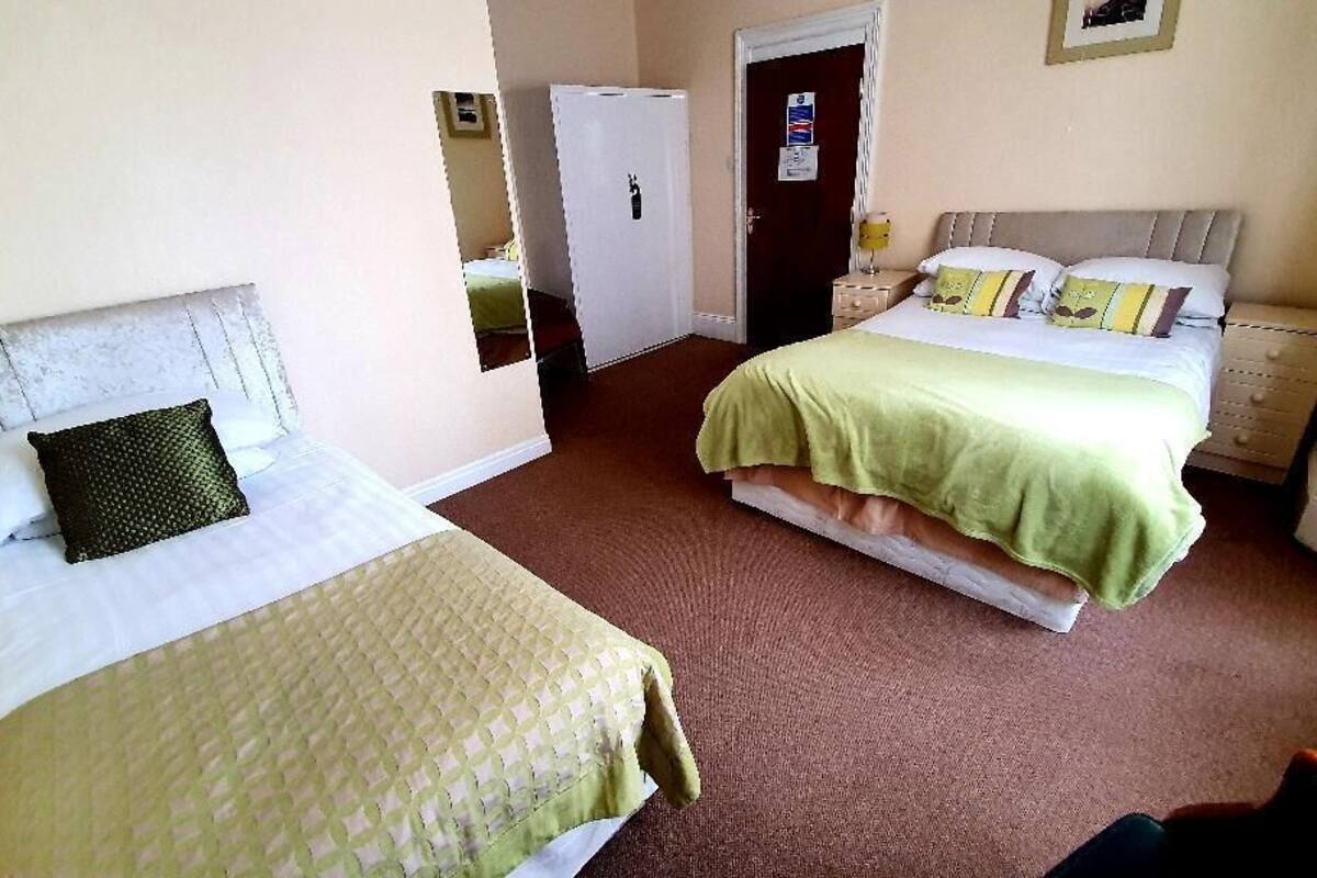 family room | desk, iron/ironing board, bed sheets