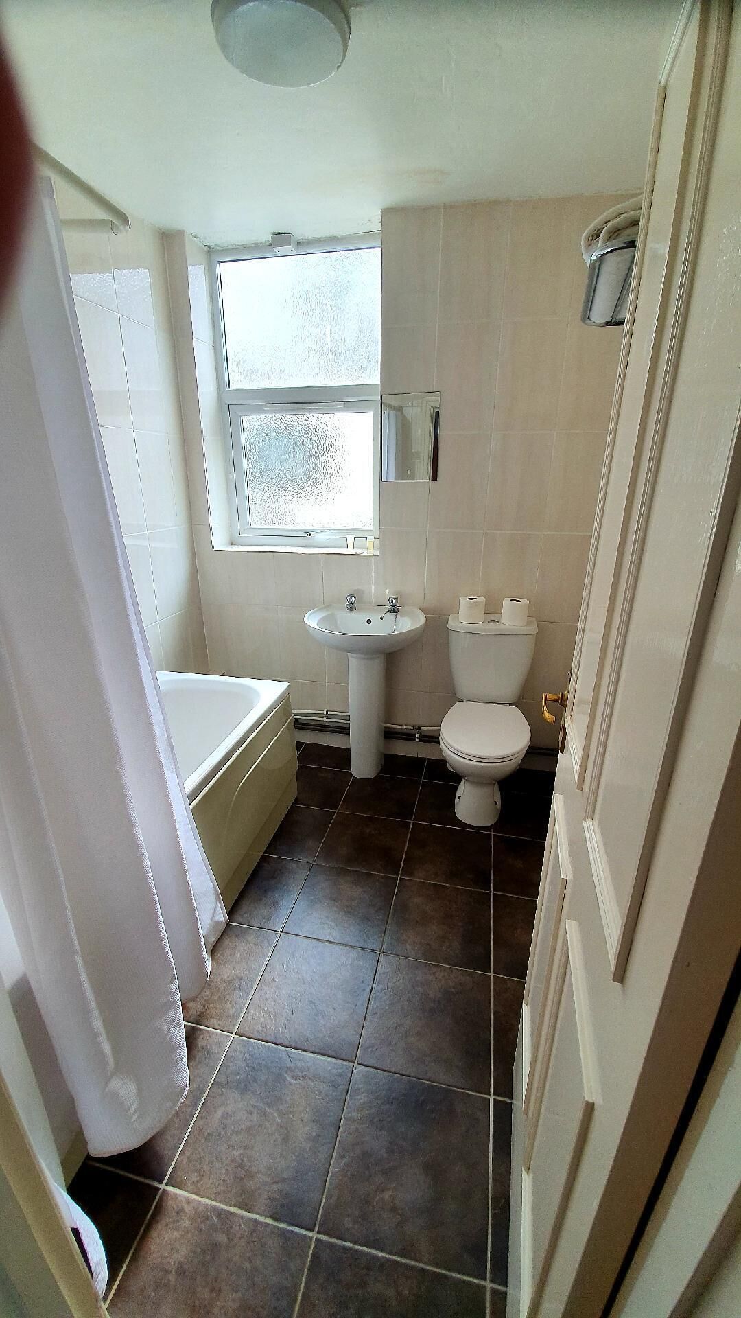 family room | bathroom | combined shower/bathtub, hair dryer, towels