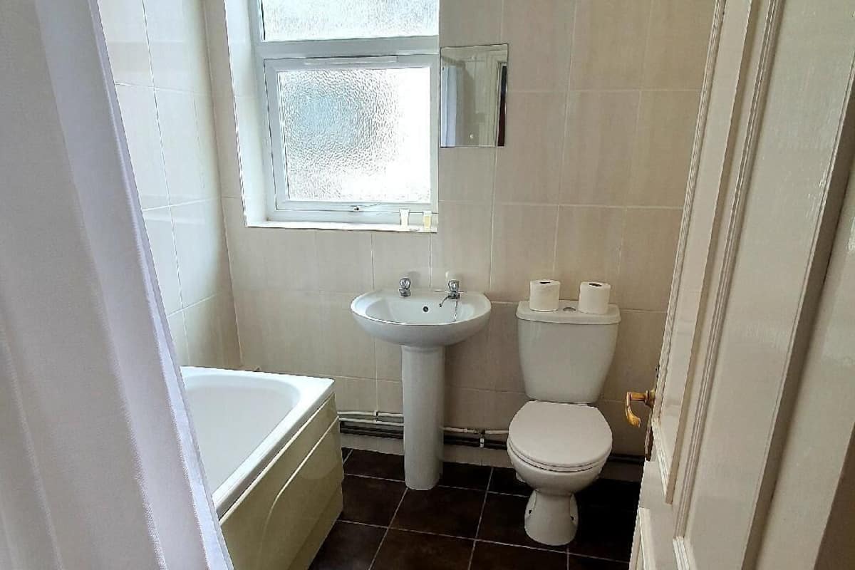 family room | bathroom | combined shower/bathtub, hair dryer, towels