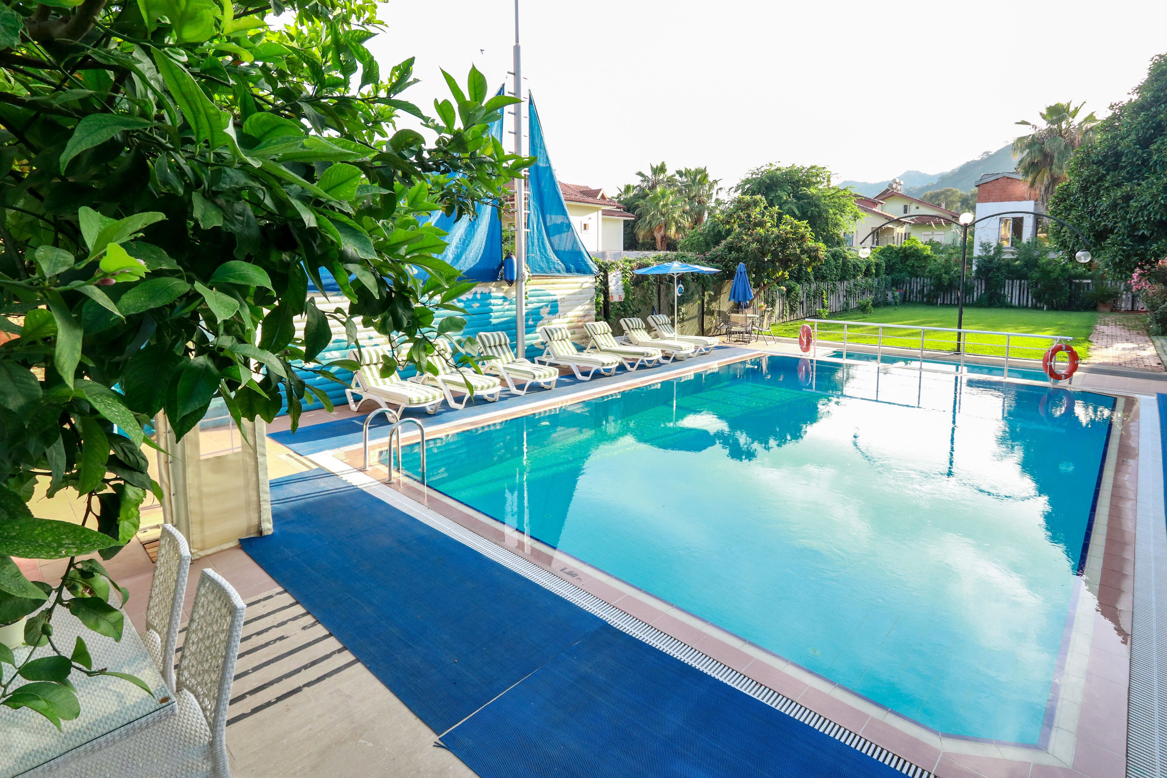 Seasonal outdoor pool, open 7:00 AM to 8:00 PM, pool umbrellas