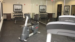 A gym with cardio equipment, dumbbells, and mirrors. - Holiday Inn Express & Suites Cumberland - La Vale by IHG (Cumberland)