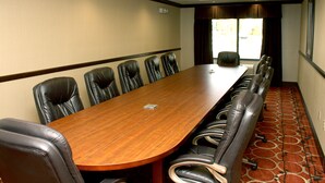 A conference room with a long wooden table and leather chairs. - Holiday Inn Express & Suites Cumberland - La Vale by IHG (Cumberland)