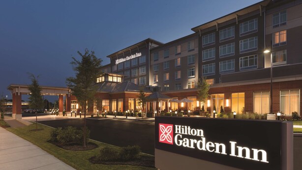A Hilton Garden Inn hotel with a modern design, featuring a large signboard with the hotel's name. - Hilton Garden Inn Boston Logan Airport (Boston)