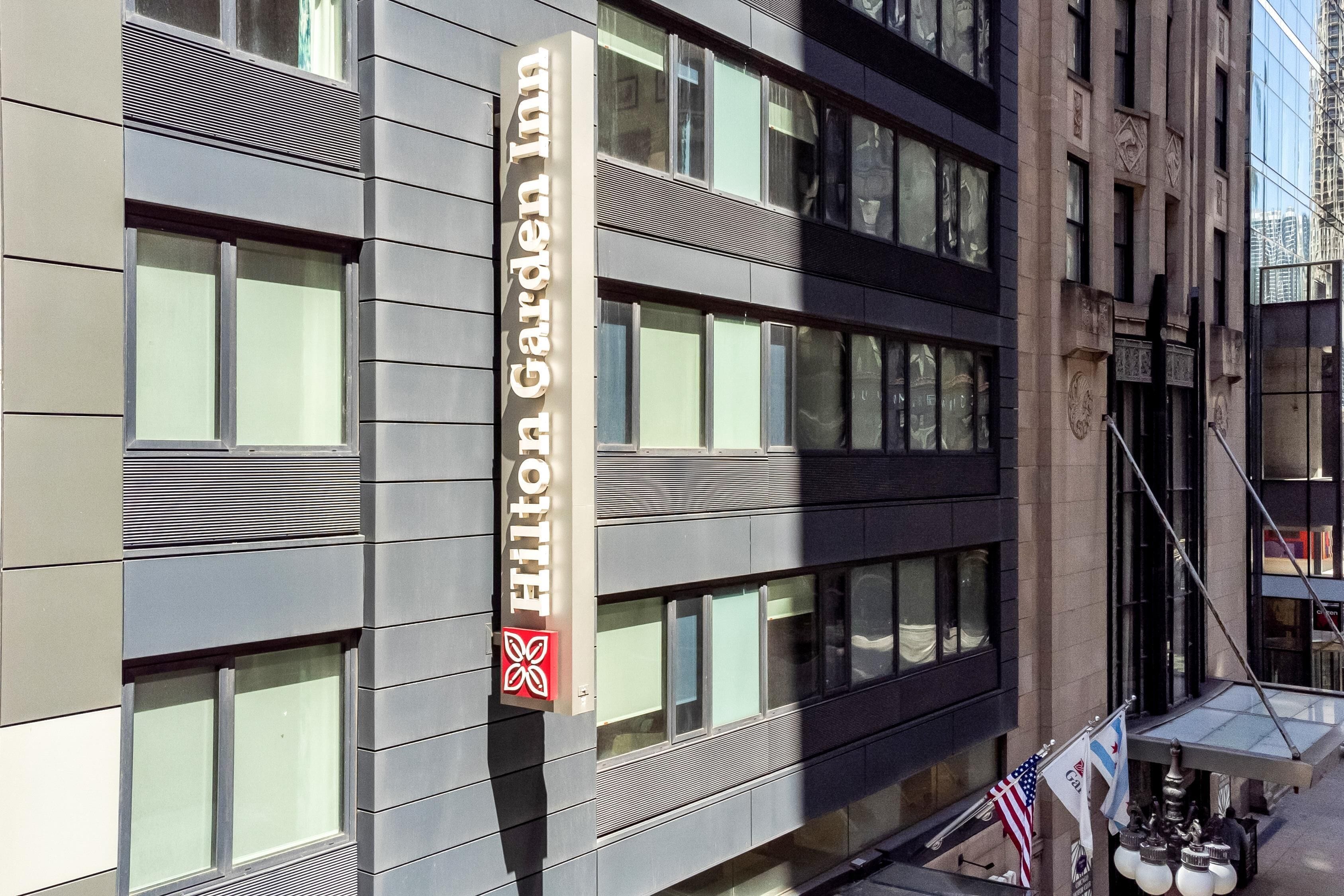 A building with a sign reading "Hilton Garden Inn".