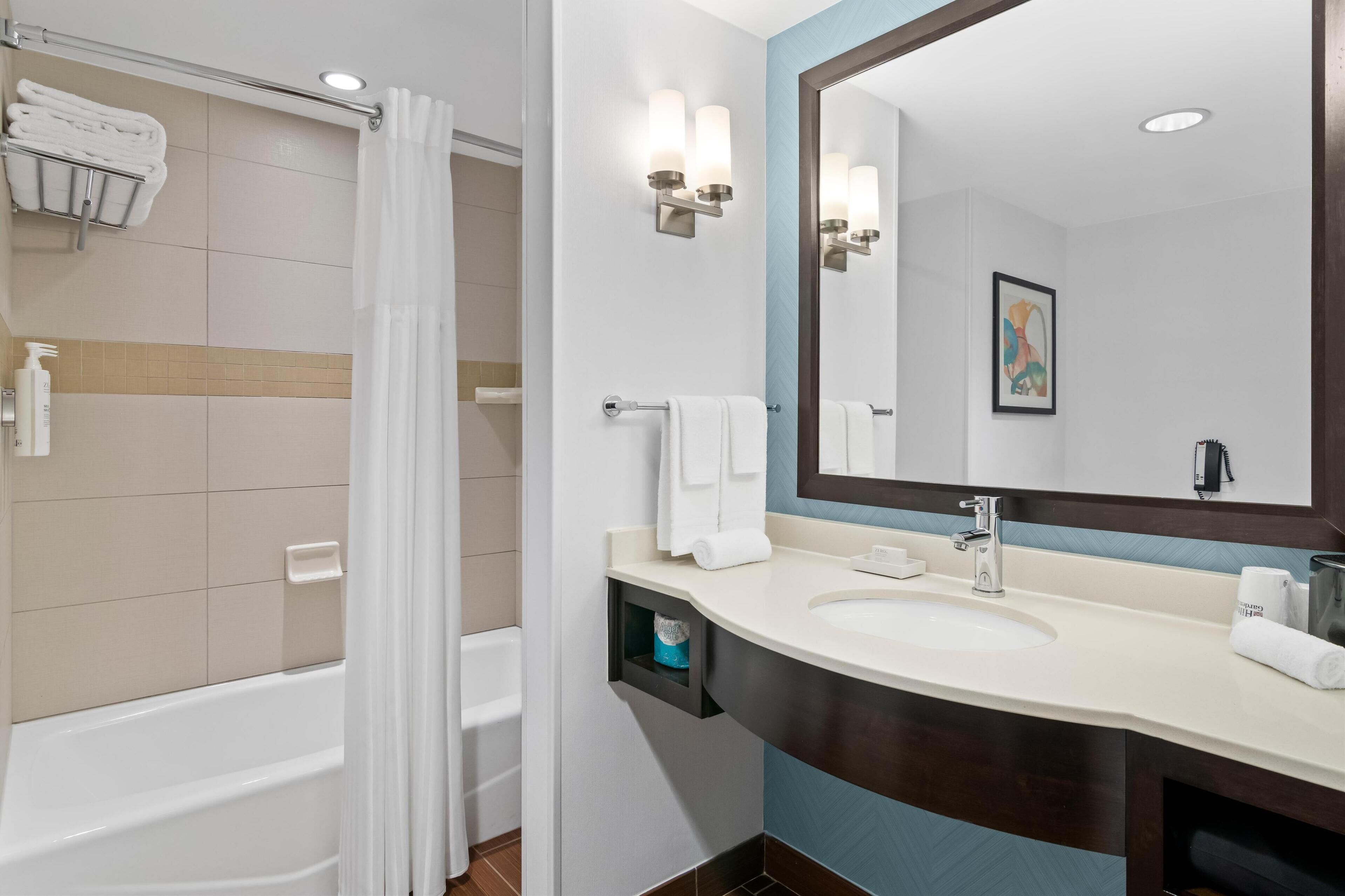 room, 2 queen beds (drinks & snacks) | bathroom | shower, designer toiletries, towels