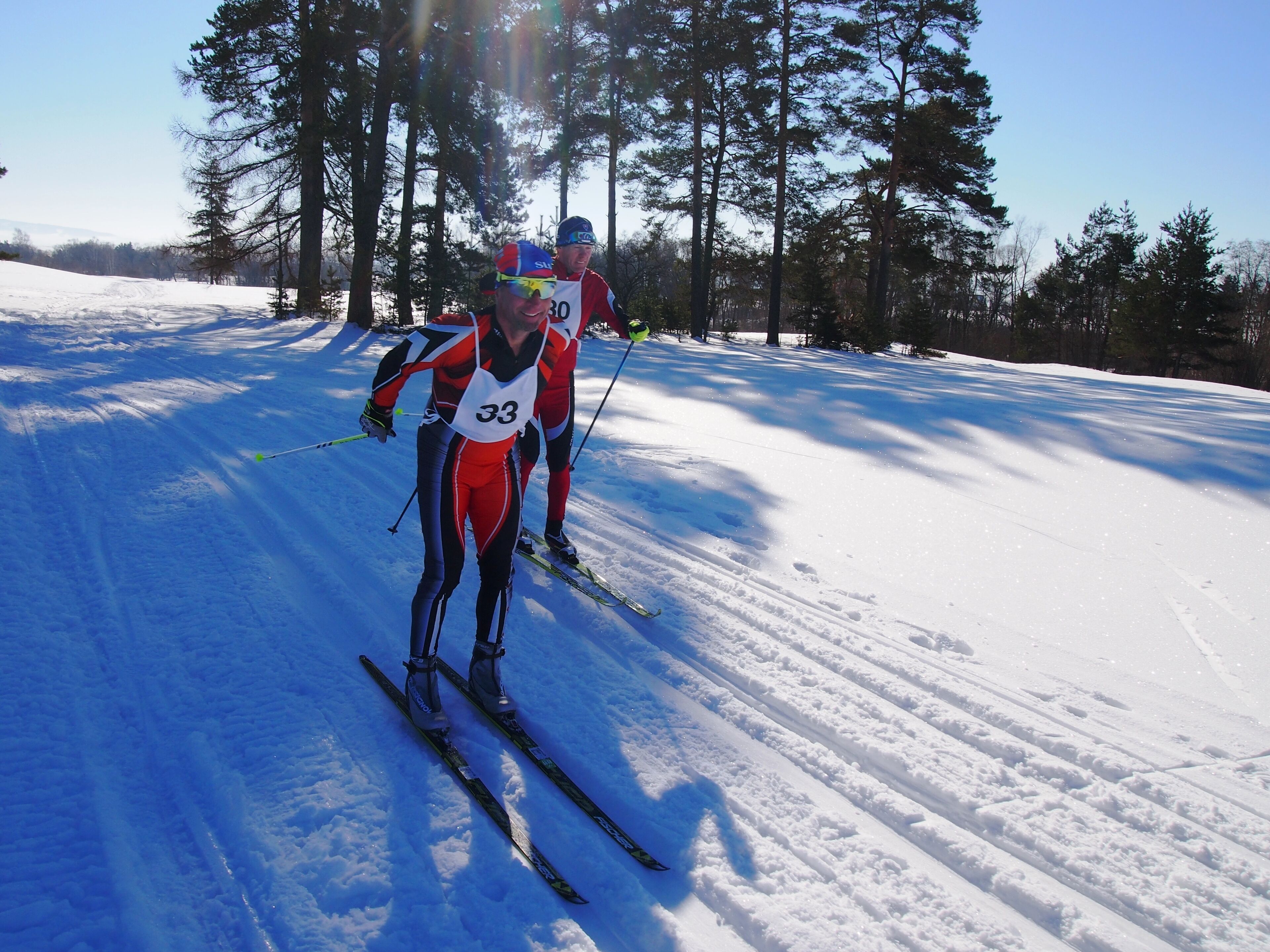 A cross-country skiing trail with numbered participants.