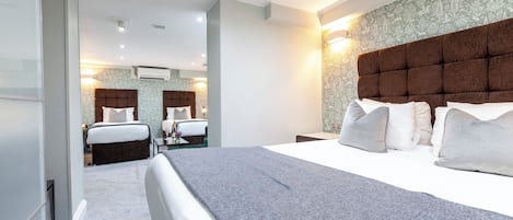 Standard Quadruple Room | Premium bedding, minibar, in-room safe, laptop workspace