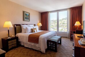 Deluxe Room, 1 King Bed | Premium bedding, down comforters, in-room safe, individually decorated