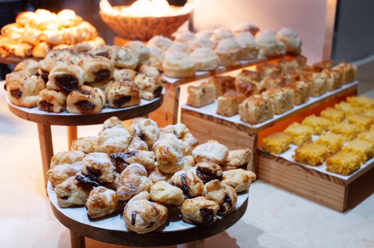 A display of assorted pastries on tiered stands.