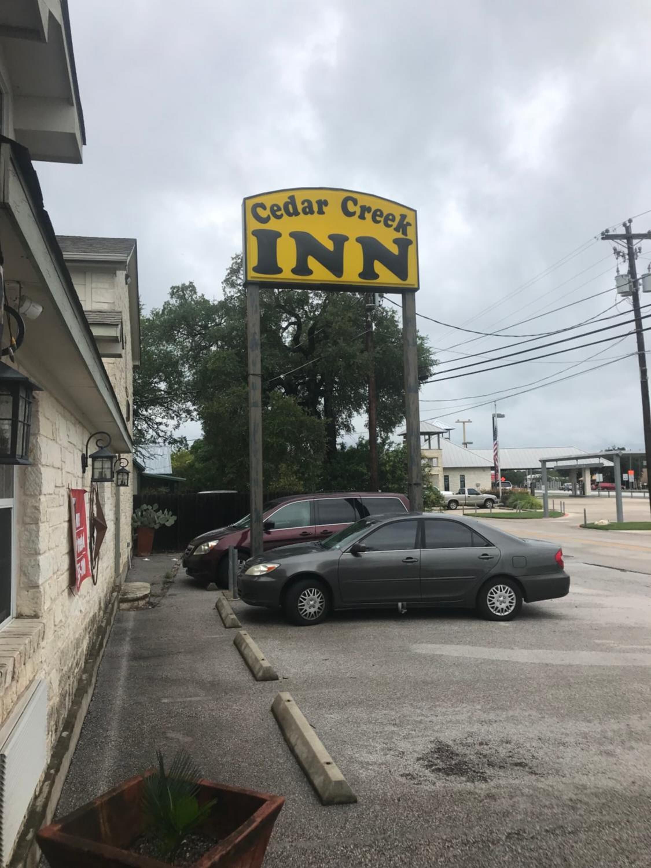 A Cedar Creek Inn signboard.