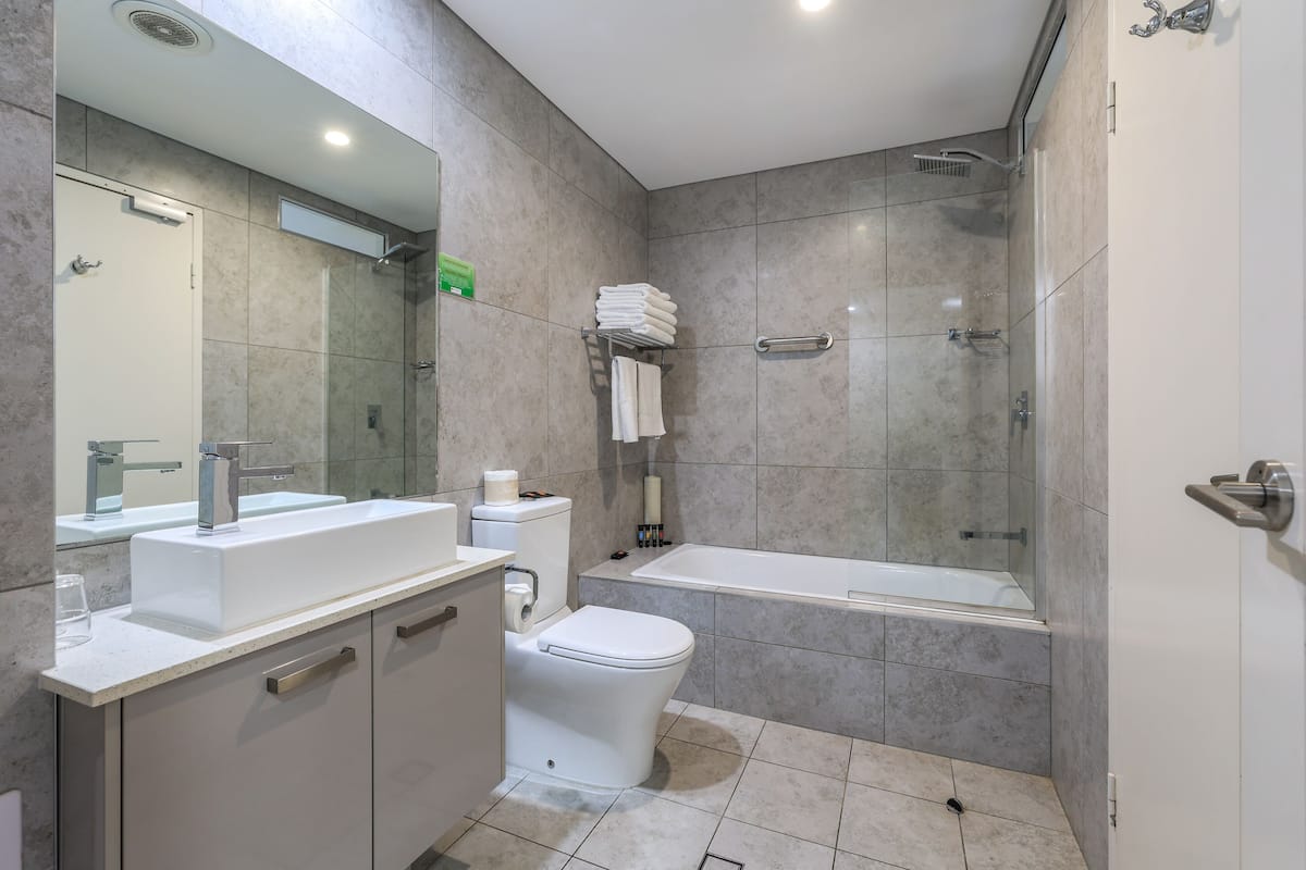 deluxe quadruple room | bathroom | free toiletries, hair dryer, towels, soap