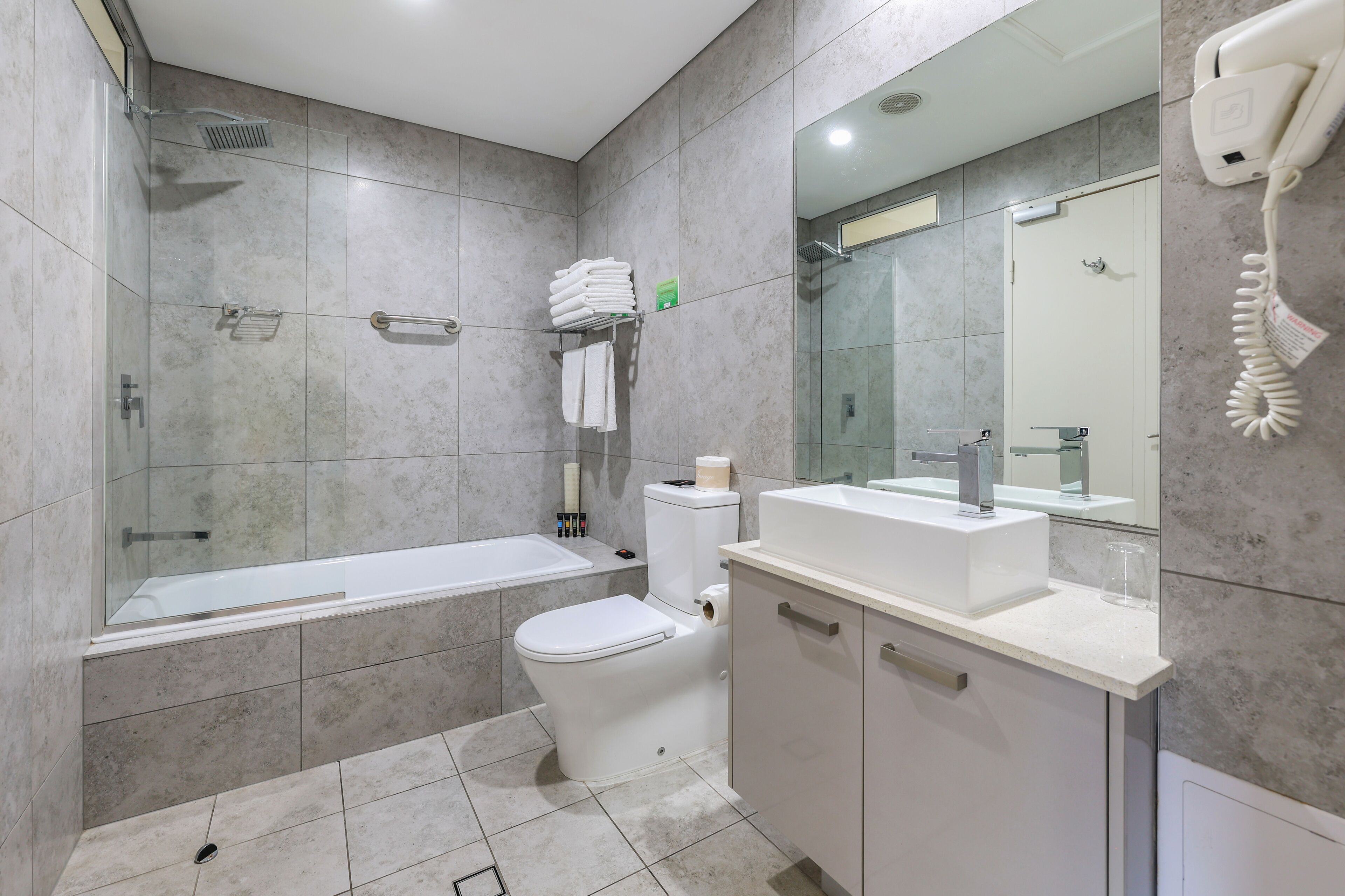 deluxe double room, 2 queen beds | bathroom | free toiletries, hair dryer, towels, soap