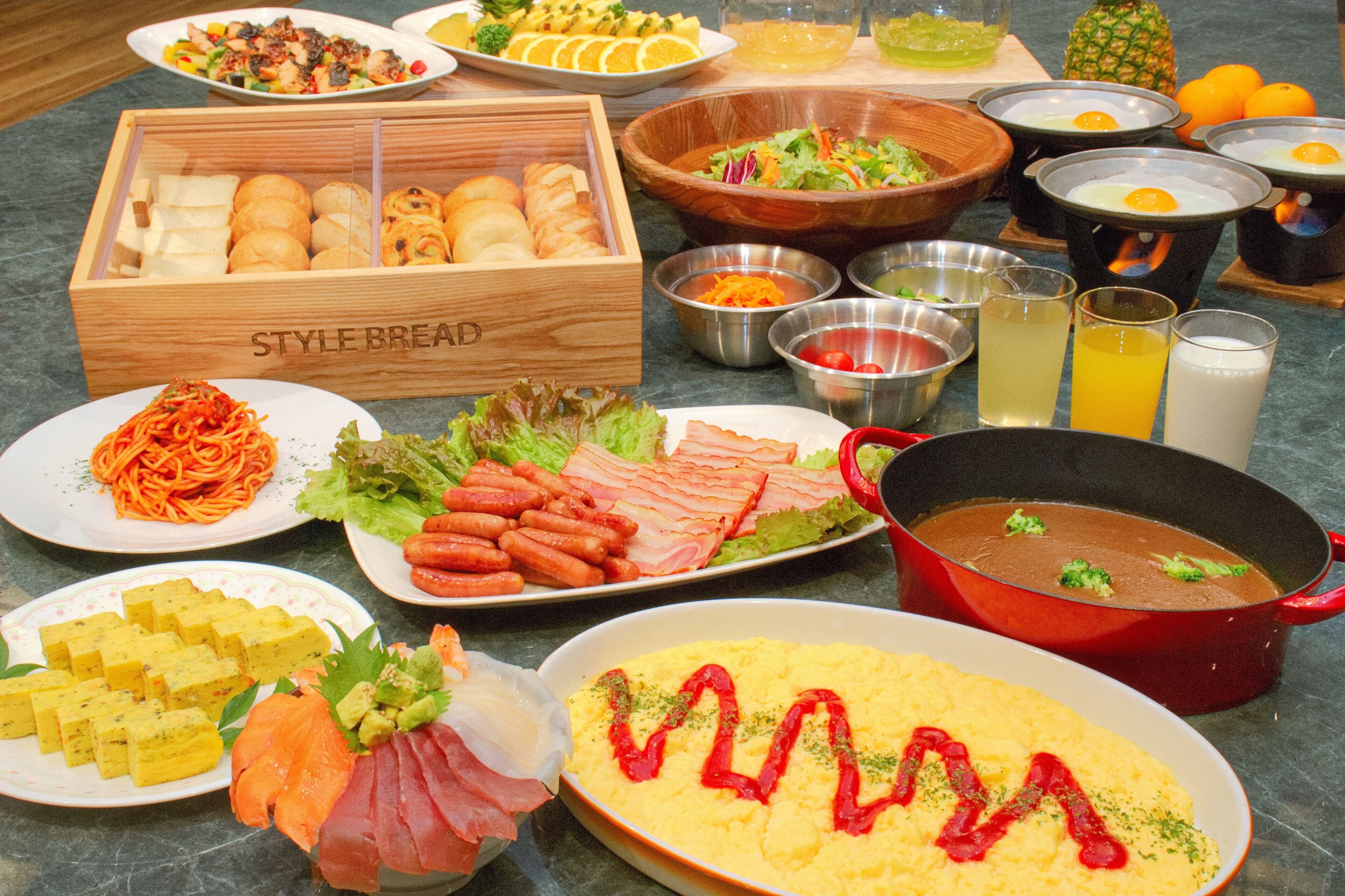 A variety of breakfast foods including eggs, bacon, and pancakes.
